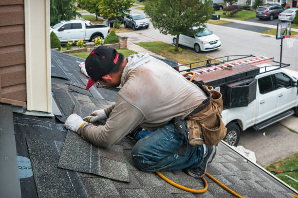 Professional Roofing technician working in Manchester, MA